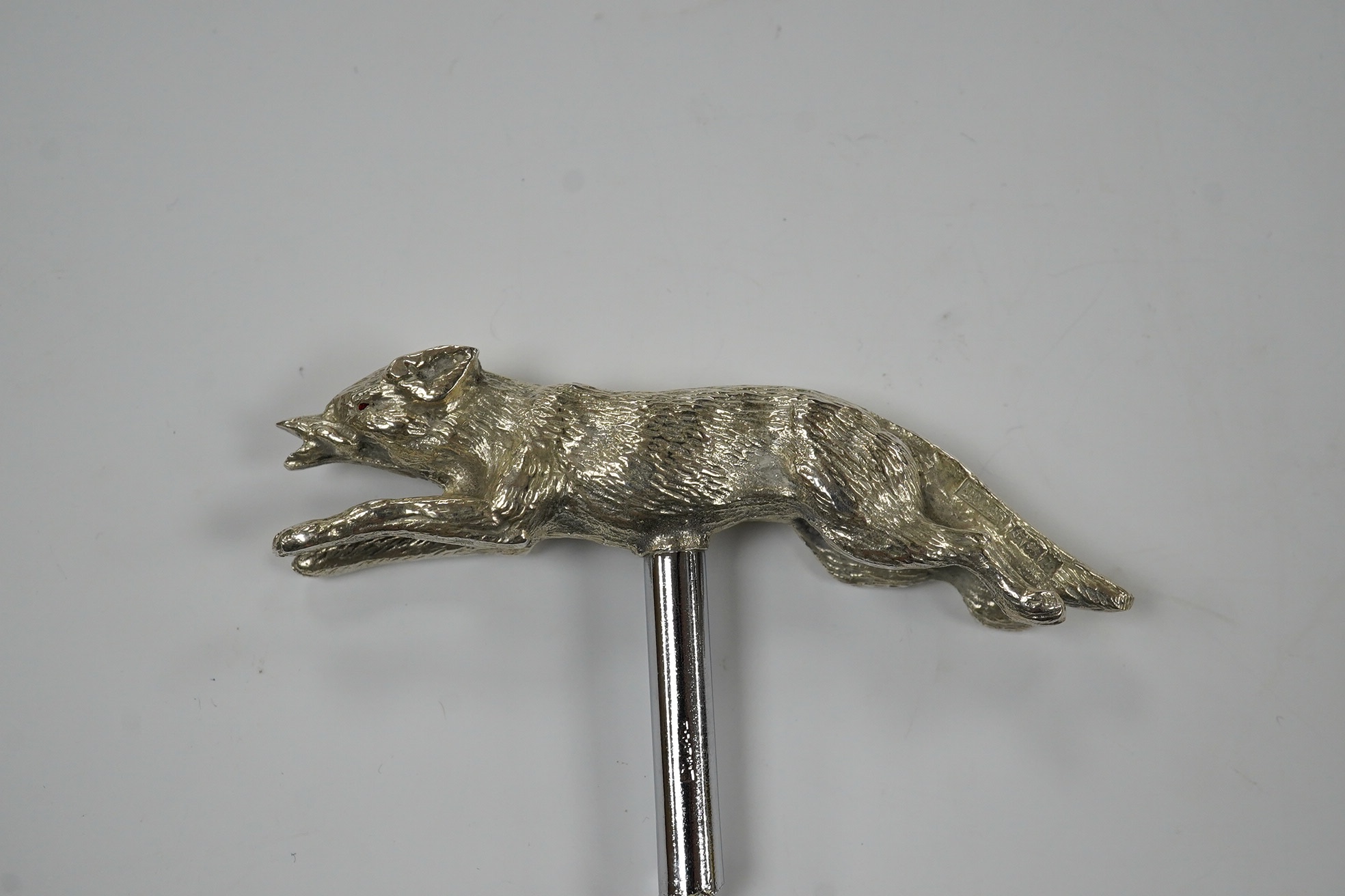 An Elizabeth II novelty silver corkscrew, the handle modelled as a running fox, J.B. Chatterley & Sons, Birmingham, 1968, fox length 85mm. Condition - good